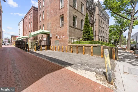 a view of a building with a street
