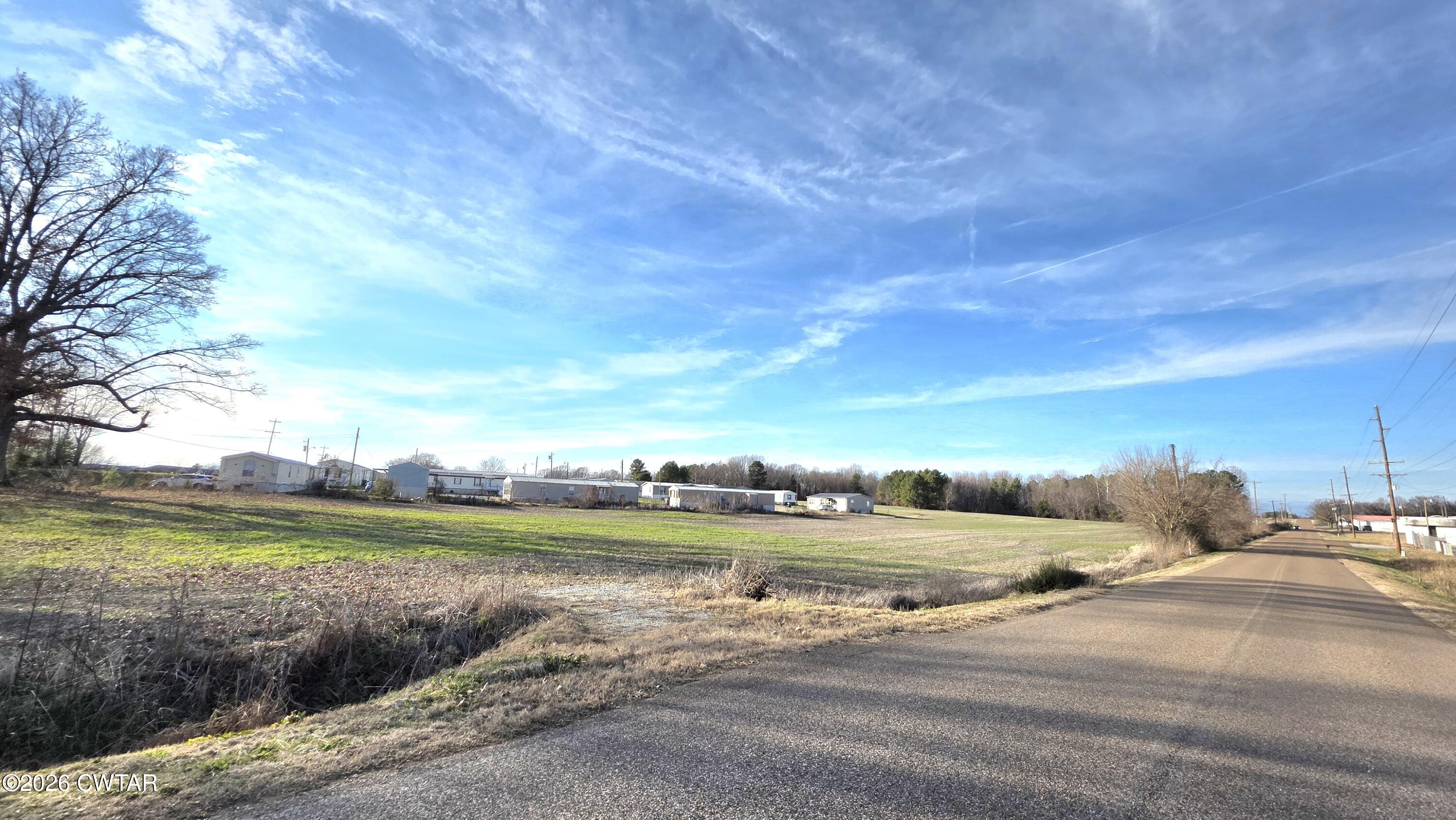 3101 Warren Road Humboldt, TN 38343 - Photo 3 of 13 a view of a lake with houses in the back