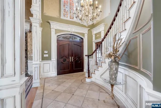 a view of a chairs and table in the patio with a balcony