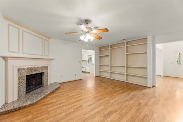 a kitchen with a sink a stove top oven and cabinets