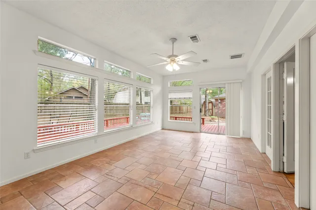 a bathroom with a granite countertop double vanity sink and mirror