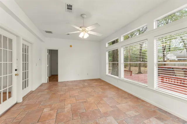 a bathroom with a granite countertop sink a mirror and a bathtub