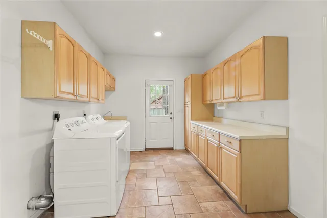 a spacious bathroom with a bathtub and shower