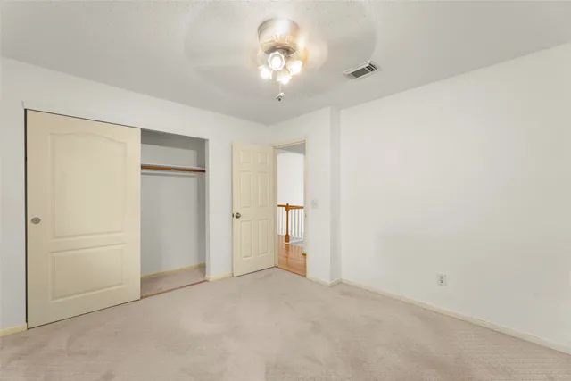 a view of a house with a large window and wooden floor