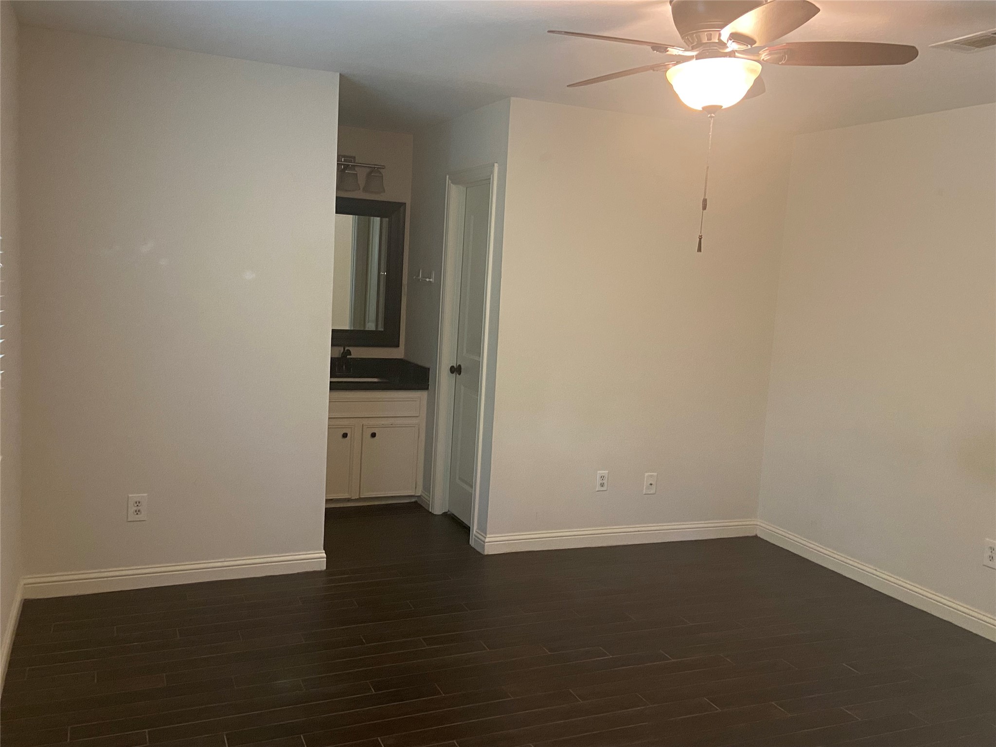 60 Oldstream Court Spring, TX 77381 - Photo 5 of 9 a view of a room with wooden floor and white walls