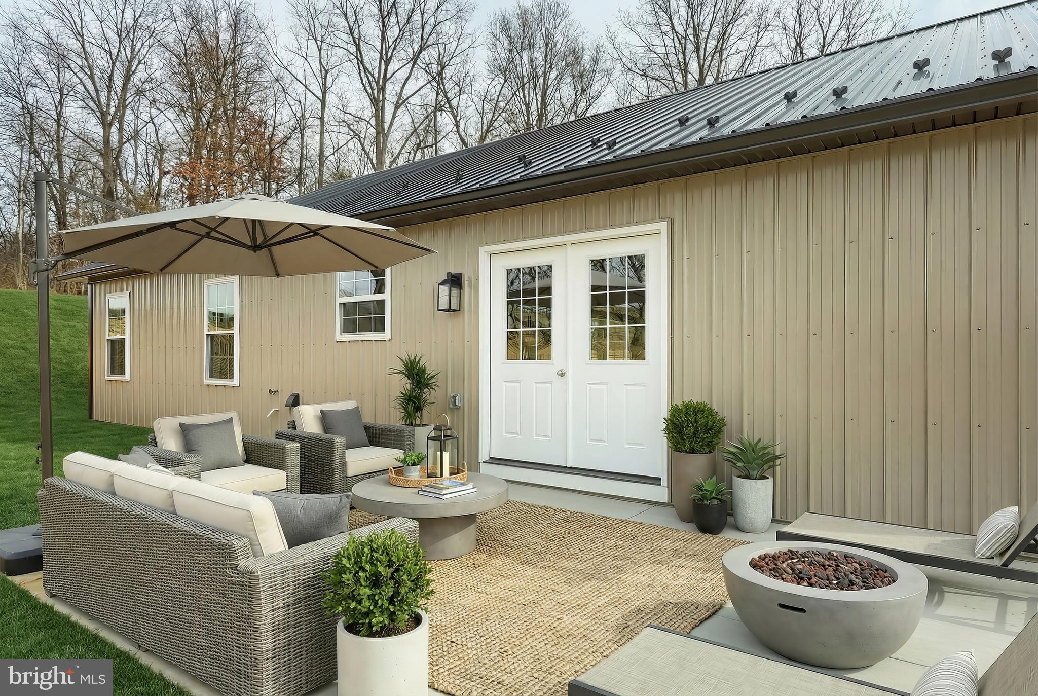 10620 Enfield Road Felton, PA 17322 - Photo 12 of 62 a view of a patio with couches table and chairs and potted plants