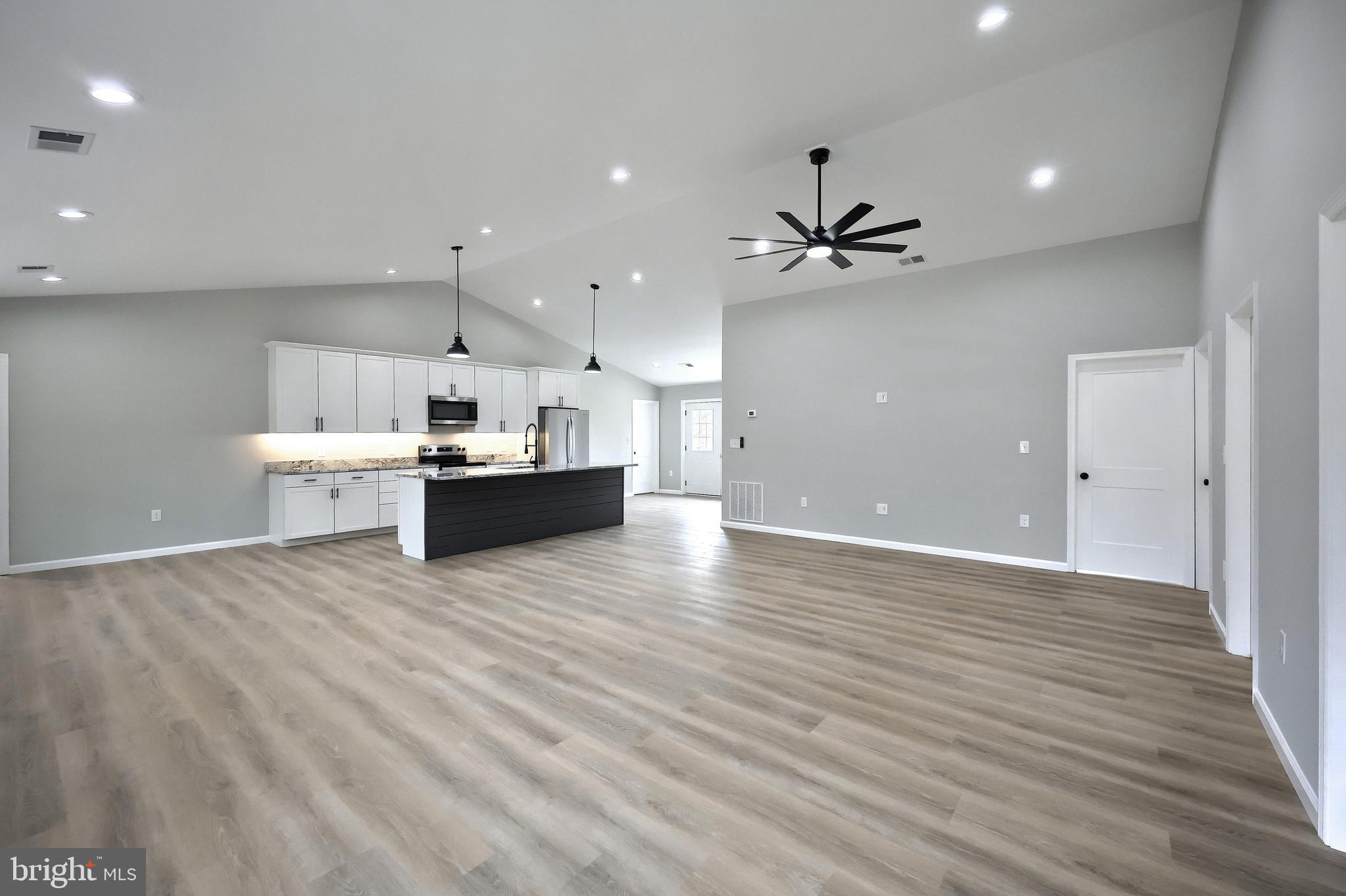 10620 Enfield Road Felton, PA 17322 - Photo 18 of 62 a view of an empty room with a kitchen
