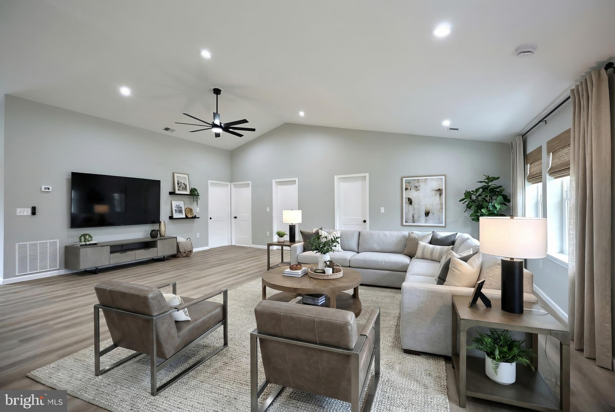 10620 Enfield Road Felton, PA 17322 - Photo 27 of 62 a living room with furniture a flat screen tv and a fireplace