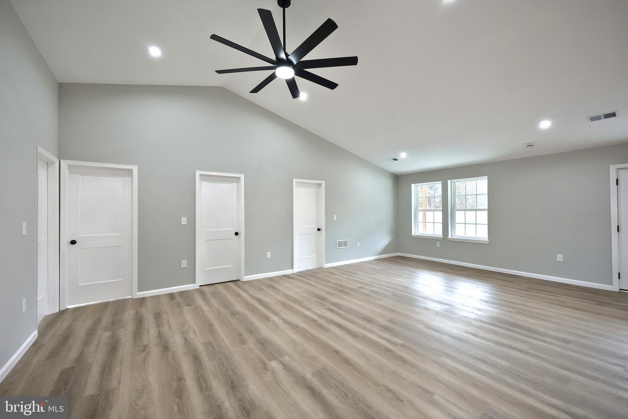 10620 Enfield Road Felton, PA 17322 - Photo 28 of 62 a view of a big room with wooden floor and windows