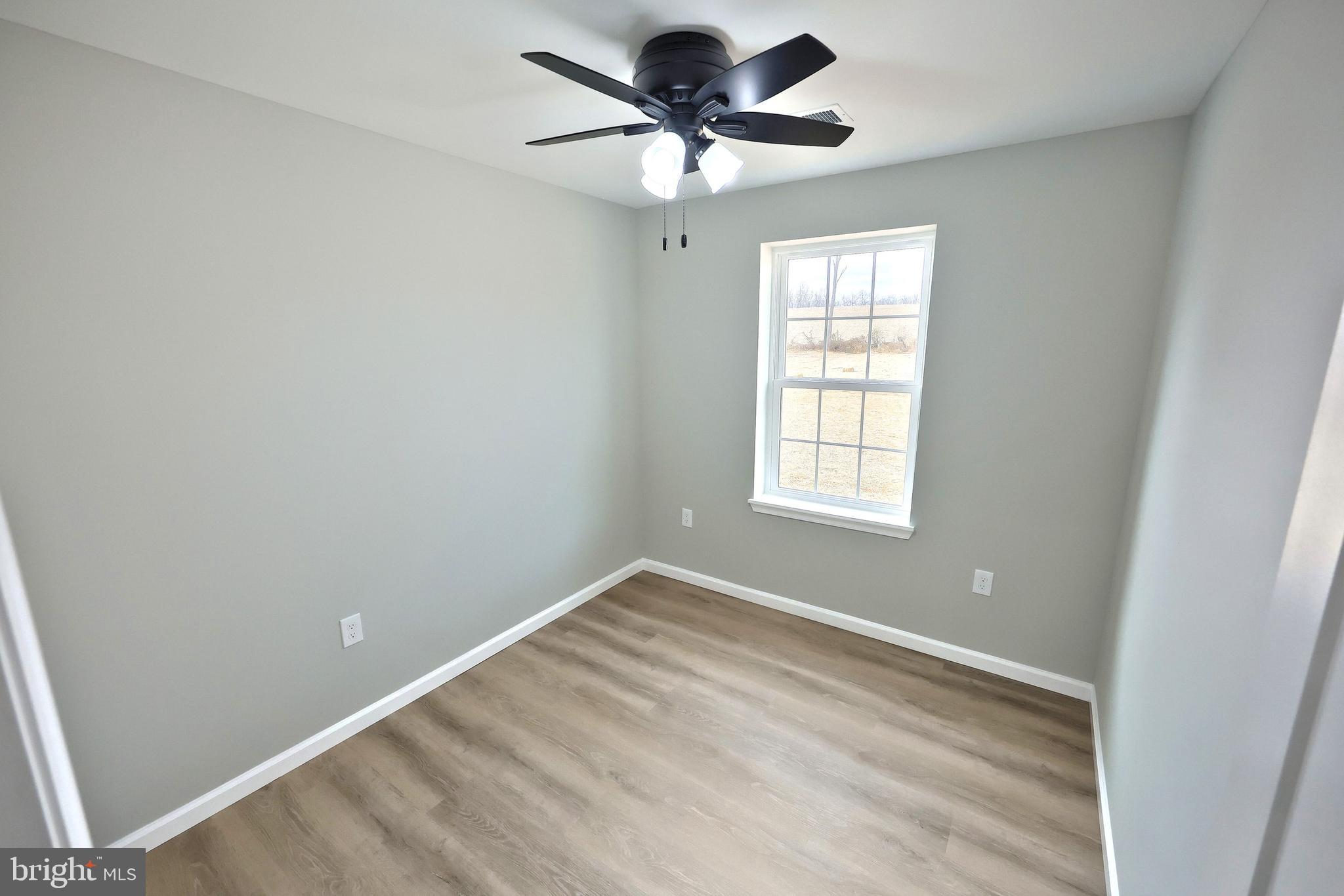 10620 Enfield Road Felton, PA 17322 - Photo 34 of 62 a view of a room with a ceiling fan and a window