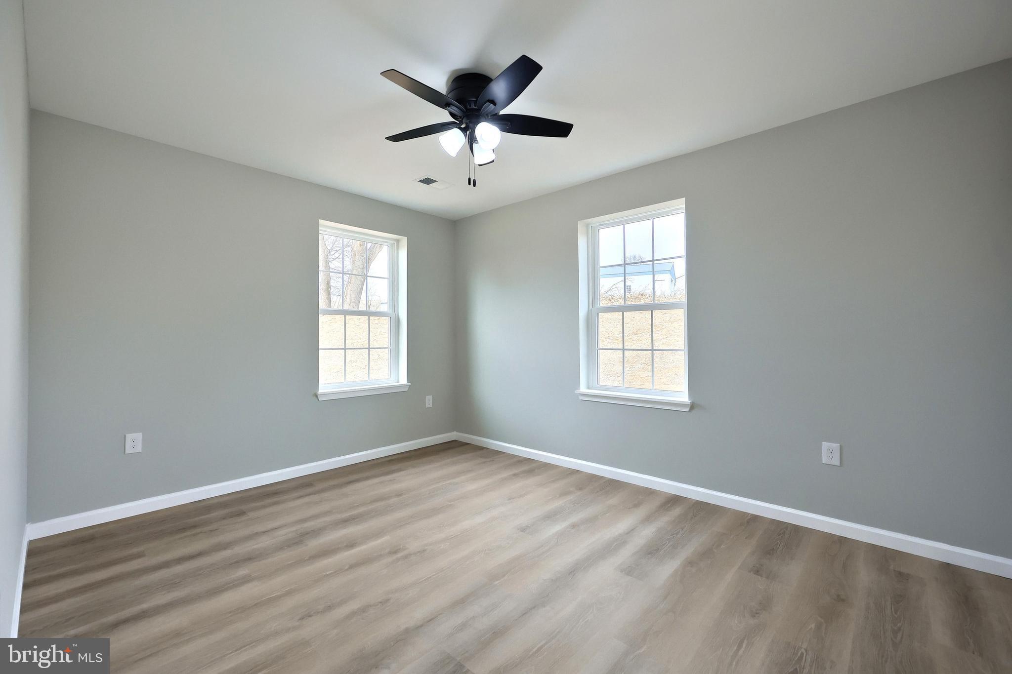 10620 Enfield Road Felton, PA 17322 - Photo 36 of 62 a view of empty room with wooden floor and fan