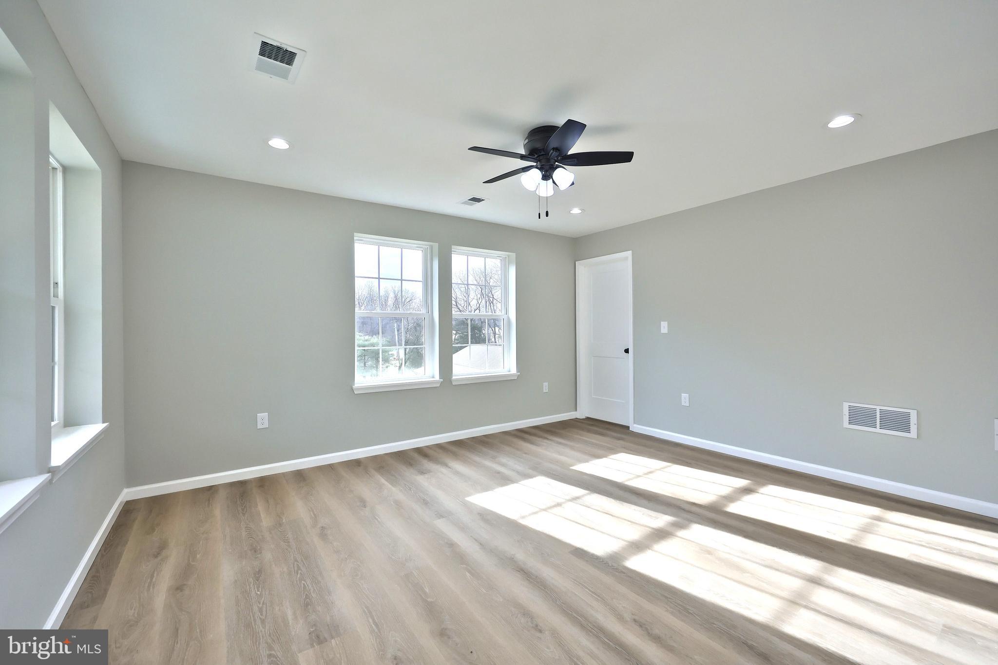 10620 Enfield Road Felton, PA 17322 - Photo 45 of 62 a view of empty room with wooden floor and fan