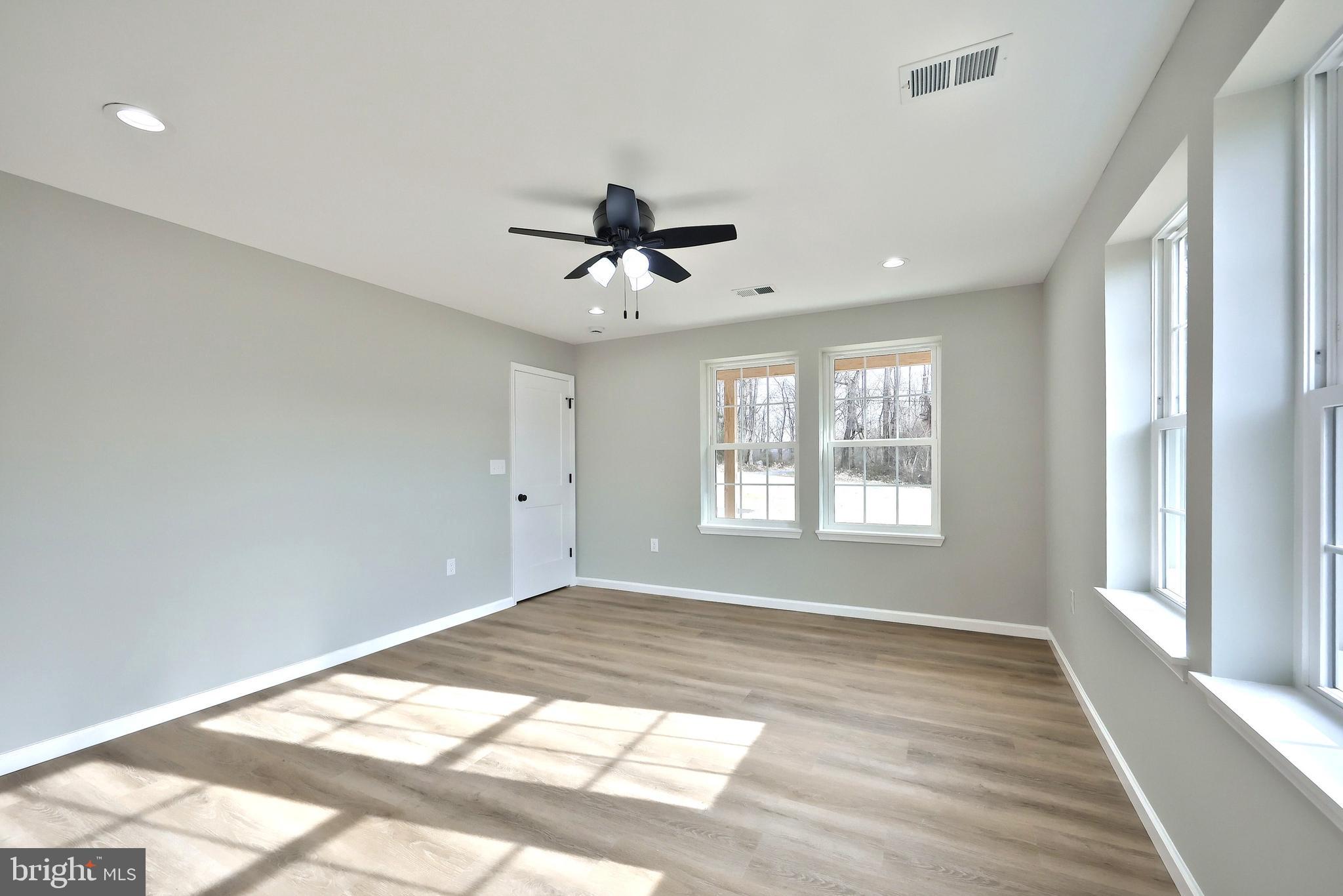 10620 Enfield Road Felton, PA 17322 - Photo 46 of 62 a view of a room with a ceiling fan and window
