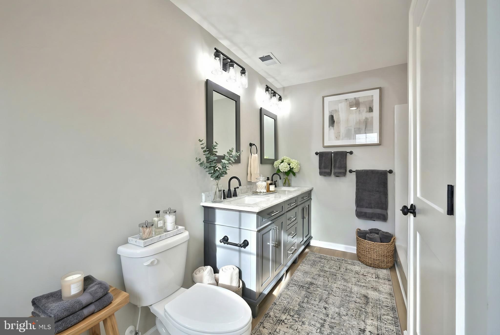 10620 Enfield Road Felton, PA 17322 - Photo 49 of 62 a bathroom with a sink toilet and shower