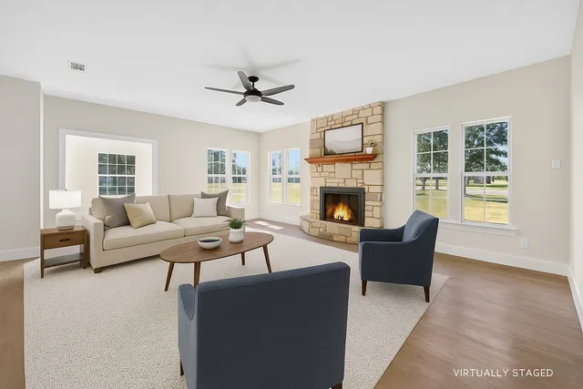 a living room with furniture and a fireplace