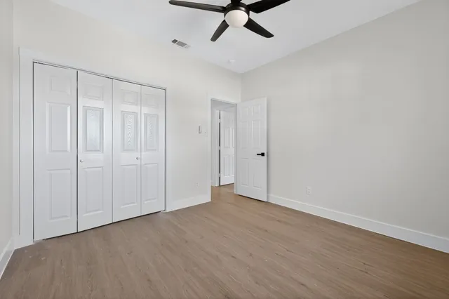 a view of room with hardwood floor