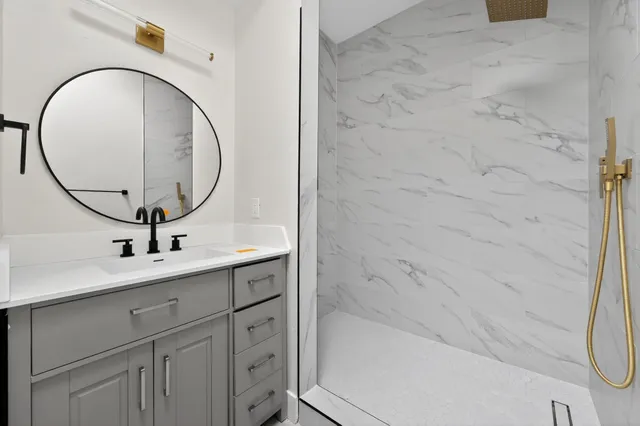 a bathroom with a sink and a mirror