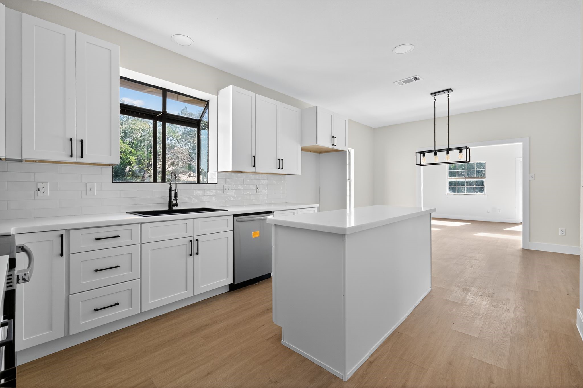 300 Fawn Lane Georgetown, TX 78628 - Photo 34 of 43 a kitchen with white cabinets and window