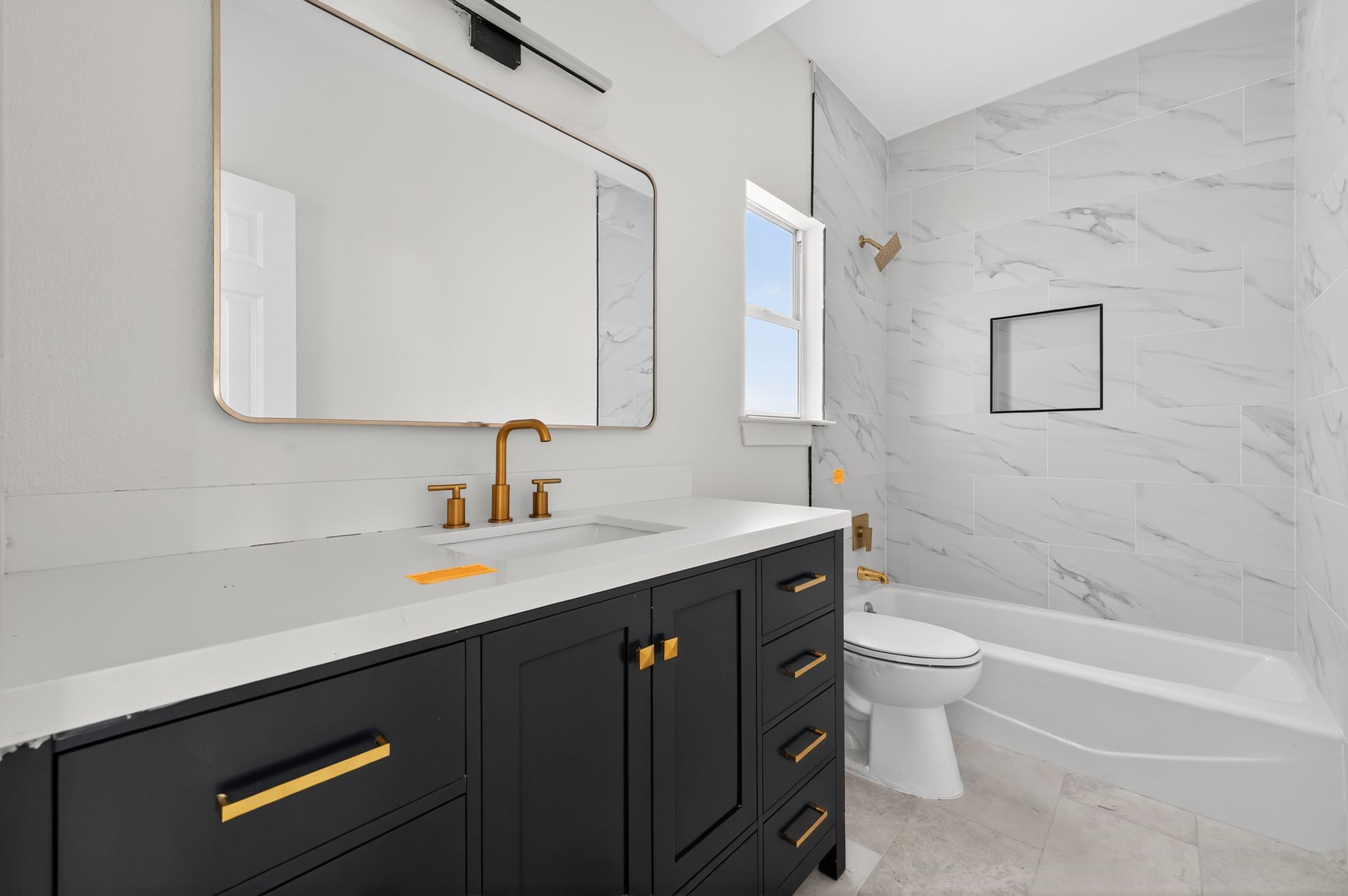 300 Fawn Lane Georgetown, TX 78628 - Photo 37 of 43 a bathroom with a sink a toilet and a bathtub