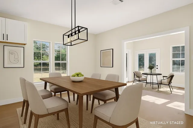 a view of a dining room with furniture window and outside view
