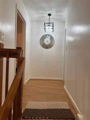 a view of room with a hallway