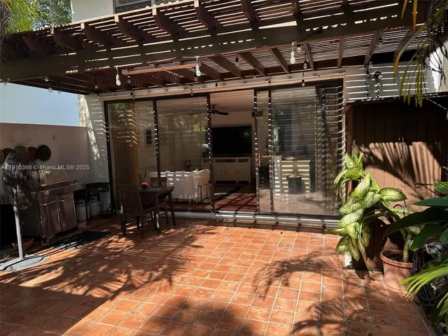 a view of a room with table and chairs