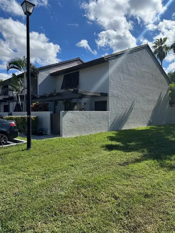 a backyard of a house with lots of green space