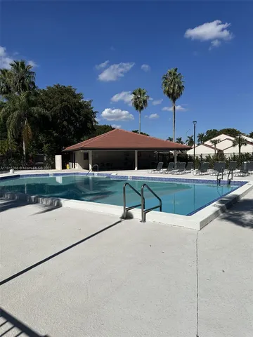 a view of a yard with house and trees