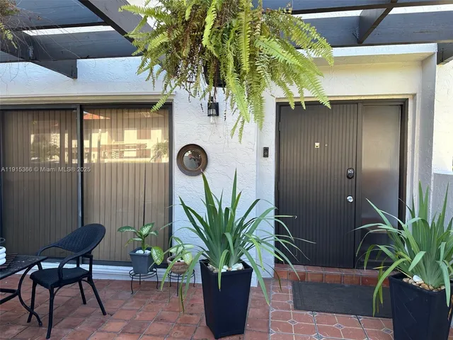 a potted plant sitting in front of a building