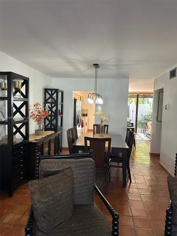 a living room with fireplace furniture and a wooden floor