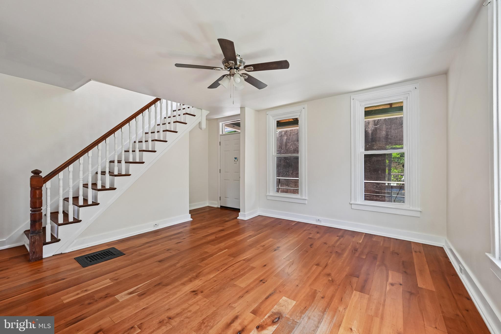 5702 Falls Road Baltimore, MD 21209 - Photo 10 of 49 a view of an empty room with wooden floor and a window