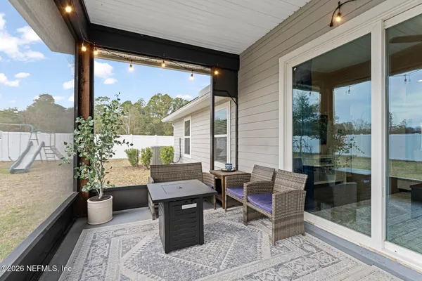 a outdoor space with patio the couches and a dining table with garden view