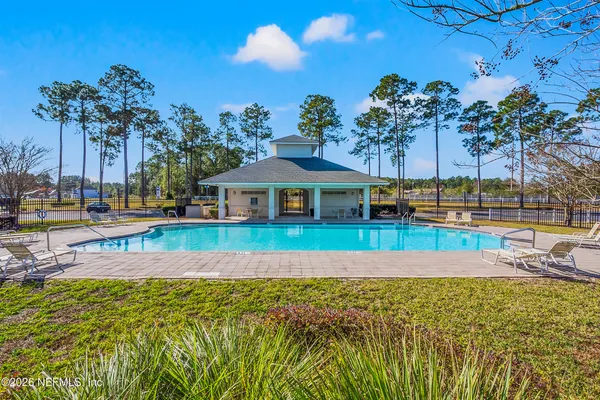 an aerial view of a house with outdoor space