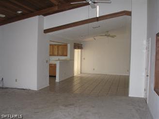 611 Southwest 57th Street Cape Coral, FL 33914 - Photo 2 of 9 a view of a big room with wooden cabinet and windows