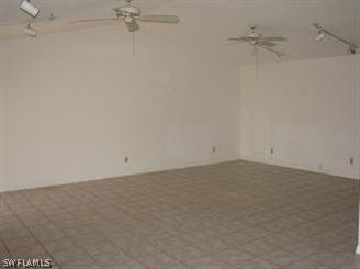 611 Southwest 57th Street Cape Coral, FL 33914 - Photo 4 of 9 a view of a room with racks on the wall