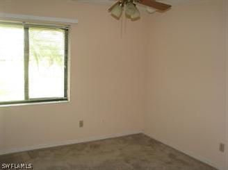 611 Southwest 57th Street Cape Coral, FL 33914 - Photo 5 of 9 an empty room with a window
