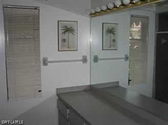 611 Southwest 57th Street Cape Coral, FL 33914 - Photo 6 of 9 an empty room that has a wooden floor