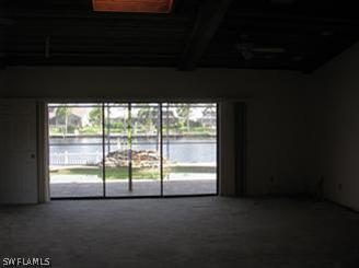 611 Southwest 57th Street Cape Coral, FL 33914 - Photo 7 of 9 a view of empty room with floor to ceiling window