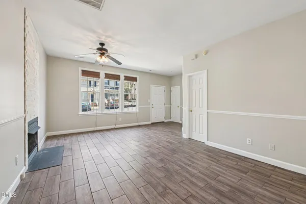 a kitchen with stainless steel appliances granite countertop white cabinets and black stove top oven