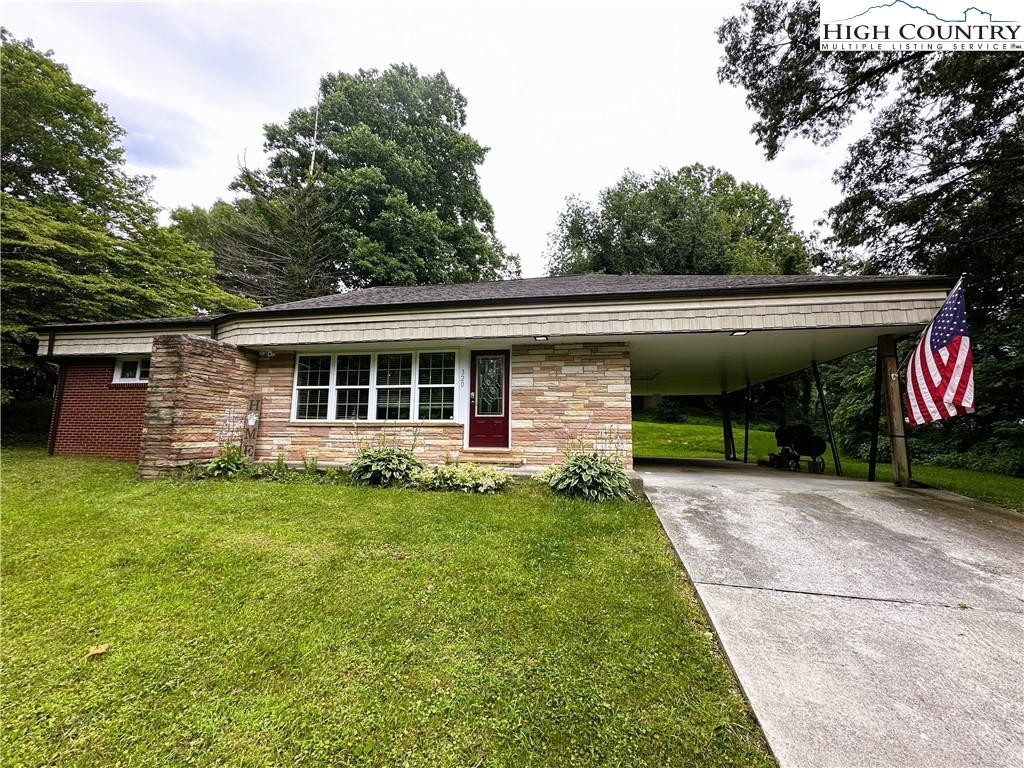 320 North Main Street Jefferson, NC 28640 - Photo 1 of 28 a front view of a house with a garden