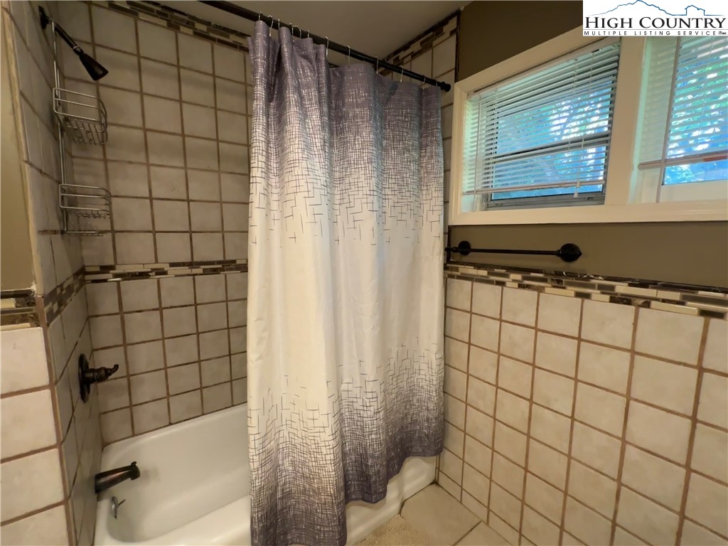 320 North Main Street Jefferson, NC 28640 - Photo 20 of 28 a bathroom with a bathtub and shower