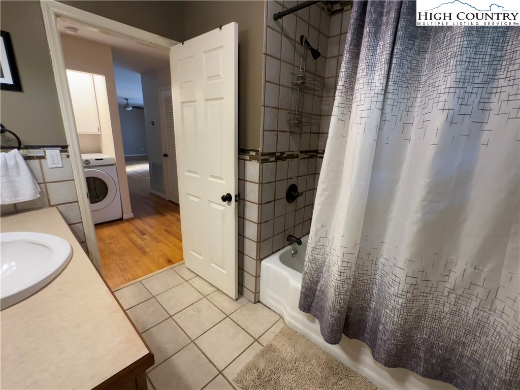 320 North Main Street Jefferson, NC 28640 - Photo 21 of 28 a bathroom with a sink and a shower