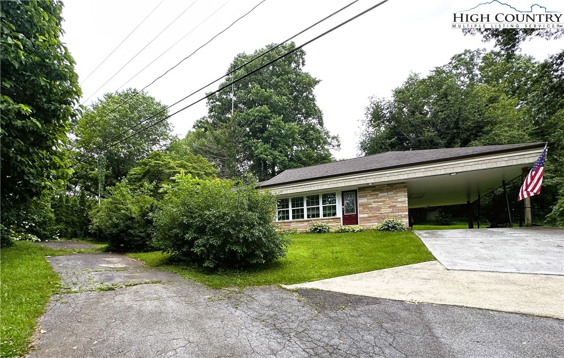 320 North Main Street Jefferson, NC 28640 - Photo 28 of 28 a view of a house with a backyard