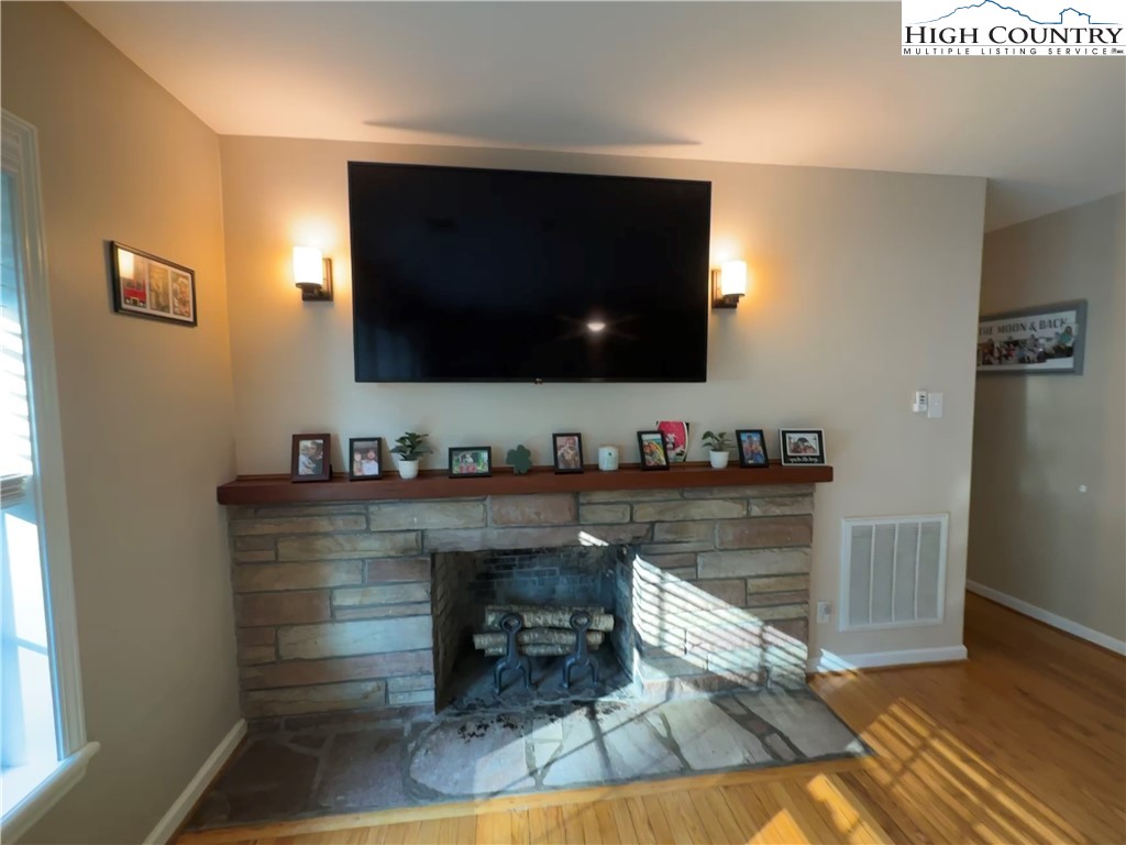 320 North Main Street Jefferson, NC 28640 - Photo 8 of 28 a living room with furniture and a flat screen tv