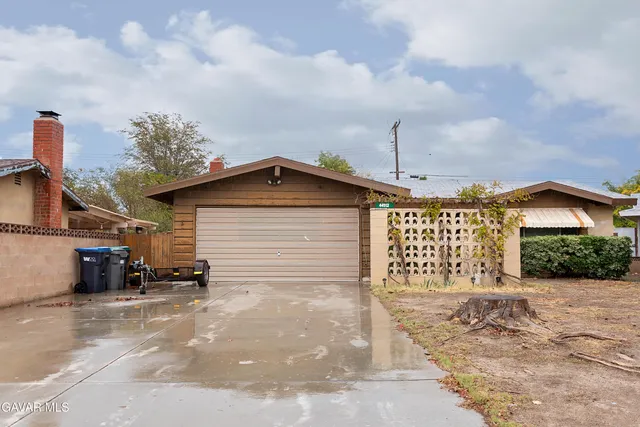 a front view of a house with a garage