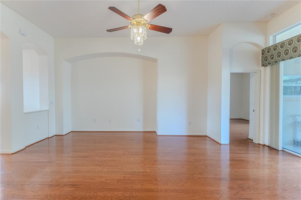 239 Longleaf Court Spring Hill, FL 34609 - Photo 13 of 55 a view of an empty room and wooden floor