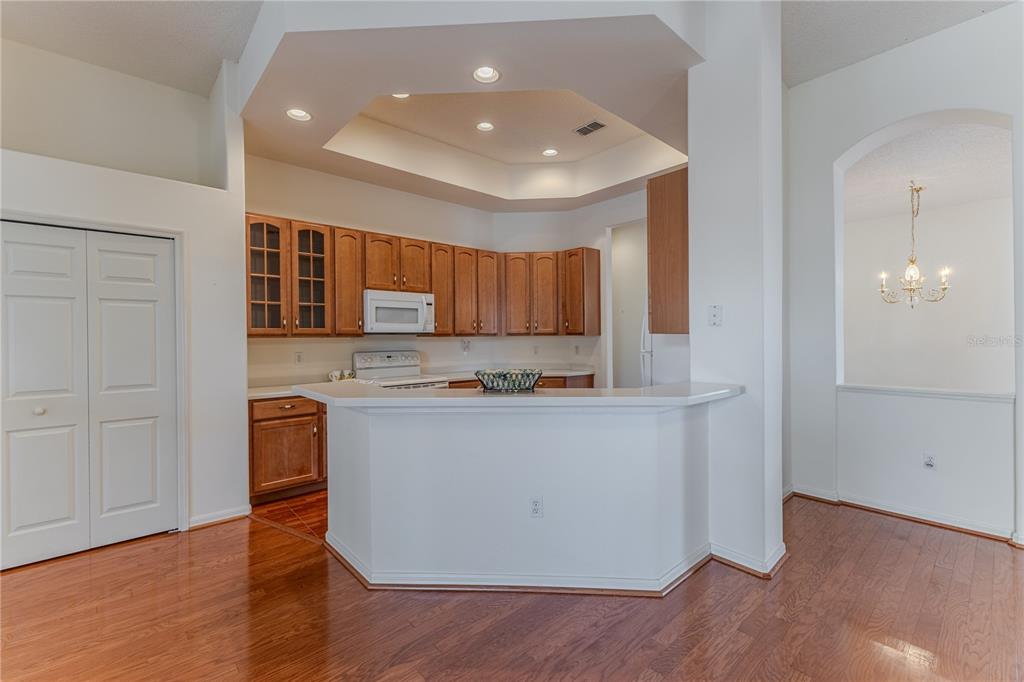 239 Longleaf Court Spring Hill, FL 34609 - Photo 16 of 55 a kitchen with stainless steel appliances granite countertop a refrigerator and a stove top oven