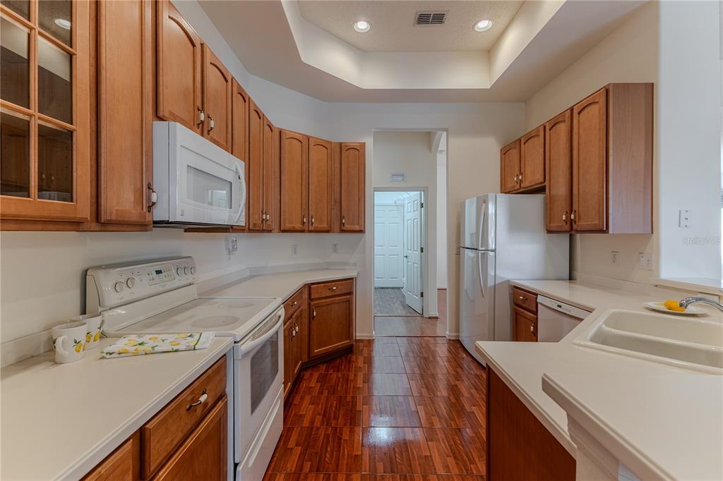239 Longleaf Court Spring Hill, FL 34609 - Photo 20 of 55 a kitchen with a sink a stove and refrigerator