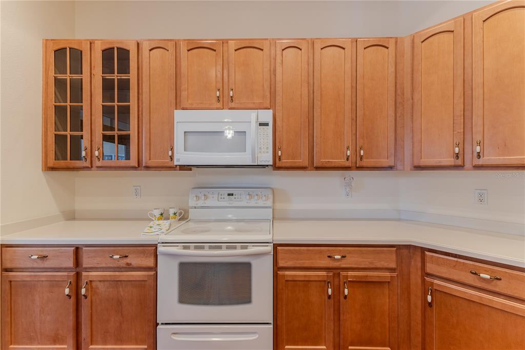 239 Longleaf Court Spring Hill, FL 34609 - Photo 21 of 55 a kitchen with stainless steel appliances granite countertop a sink a stove and cabinets