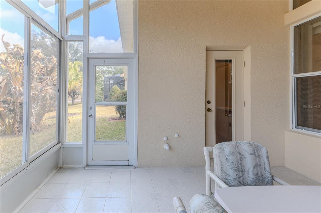 239 Longleaf Court Spring Hill, FL 34609 - Photo 27 of 55 a living room with furniture and a large window
